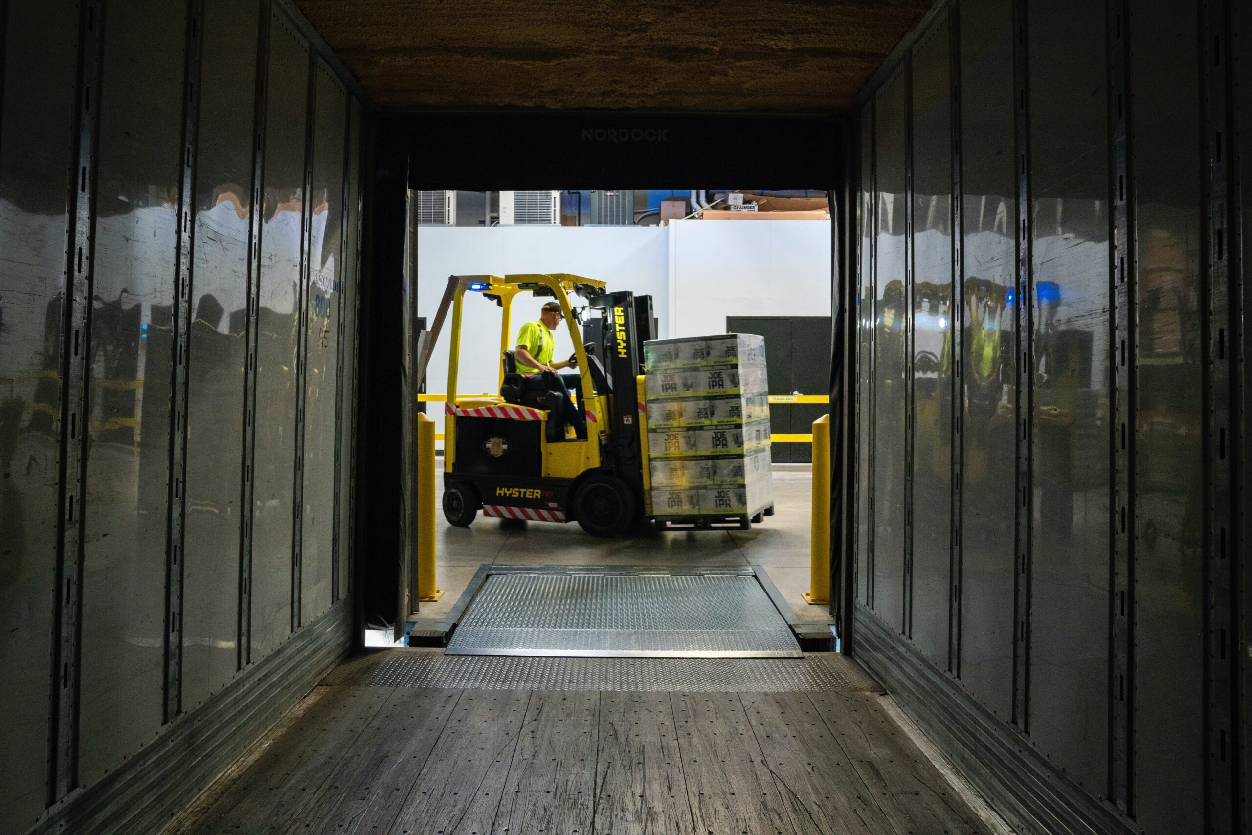 Forklift operator unloading a trailer