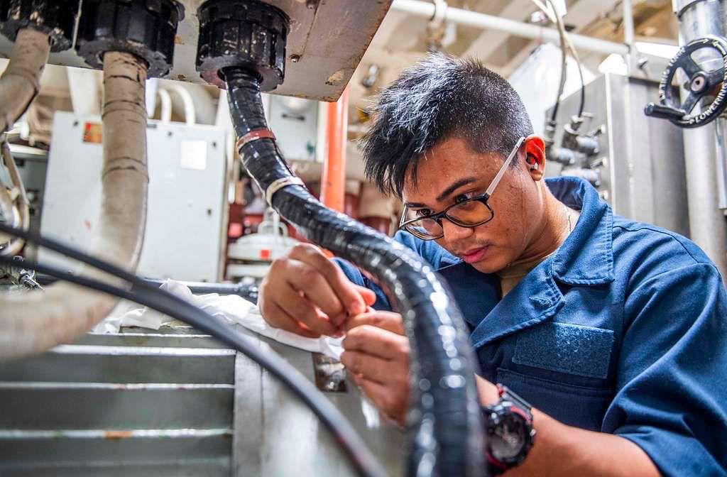 Man creating an injection mold for mass production